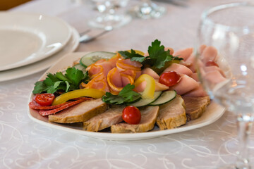 Cold meat snack food. A dish on the festive table.
