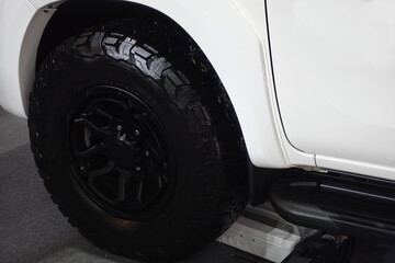 Pickup truck tires and wheels for off-road driving.