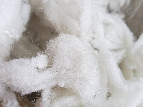 White sintepon for filling soft toys, pillows in close-up. Holofiber.