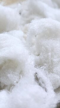 White sintepon for filling soft toys, pillows in close-up. Holofiber.