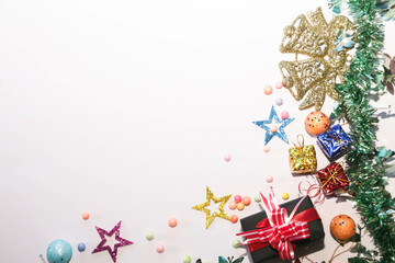Season's greetings scene. Christmas decorations,gift boxes with red ribbons, сhristmas balls, ...