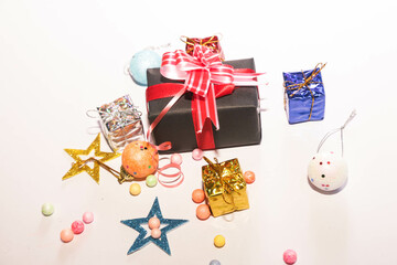 Season's greetings scene. Christmas decorations,gift boxes with red ribbons, сhristmas balls, ...