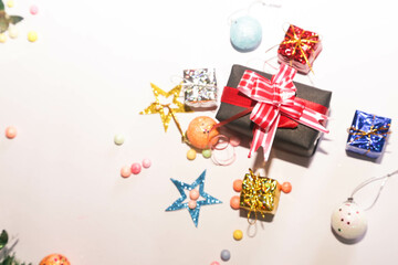 Season's greetings scene. Christmas decorations,gift boxes with red ribbons, сhristmas balls, ...