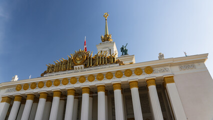 VDNH in Moscow. Building with columns with gold decoration