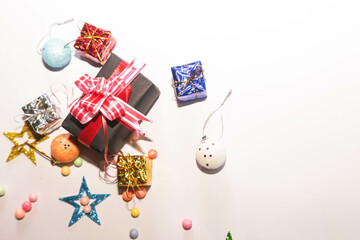 Season's greetings scene. Christmas decorations,gift boxes with red ribbons, сhristmas balls, ...
