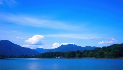 view of a lake with mountains in the background