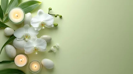 Serene and Tranquil Arrangement of White Orchids, Candles, and Smooth Stones on a Soft Green Background for Relaxation and Wellness Themes