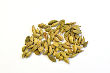 Cardamom spice whole, on white background, top view.