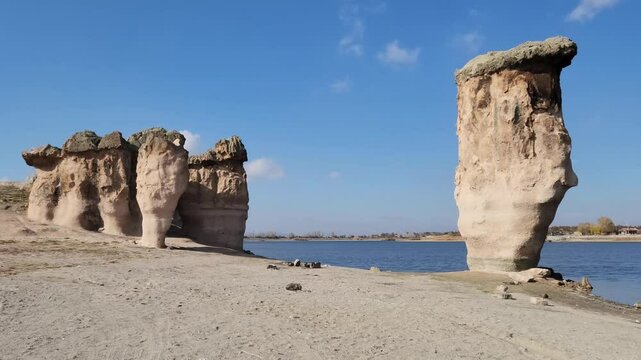Magical rock formations by the side of the Lake Emre which is a serene natural oasis, surrounded by lush greenery and ancient rock formations in the heart of Phrygian Valley in Afyonkarahisar.