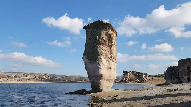 Striking rock formation by the side of the Lake Emre which is a serene natural oasis, surrounded by lush greenery and ancient rock formations in the heart of Phrygian Valley in Afyonkarahisar.