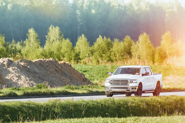 Light colored american ram truck on a sunny day in nature