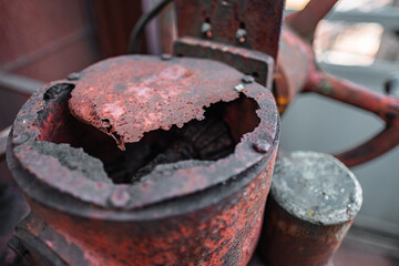 Close-Up of a Rusted and Weathered Metal Structure Highlighting Natural Decay and Industrial Texture in an Urban Environment on a Cloudy Day