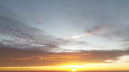 Golden sunrise illuminating agricultural fields
