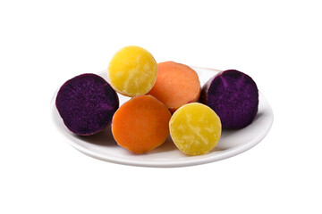 Steamed purple, orange and yellow sweet potatoes on plate ready to eating	