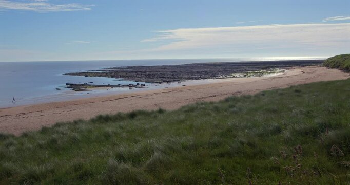 extra wide shot looking east from the dunes at Longhoughton beach of the howdiemony sands at lowtide, Alnwick