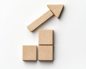 Wooden blocks arranged in upward arrow shape on white background