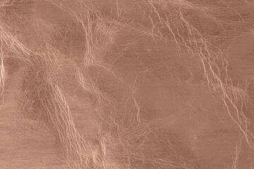 Empty brown shiny color aged grunge  leather texture with cracks. Trendy color 2025 year Mocha Mousse.