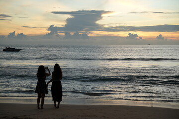 silhouette of a couple on the beach at sunset