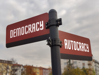 Navigating Choices: A Signpost of Life's Pathways Representing THRIVE, Democracy, and Autocracy Amid Nature's Calm, Encouraging Reflection on Our Governance and Personal Journeys