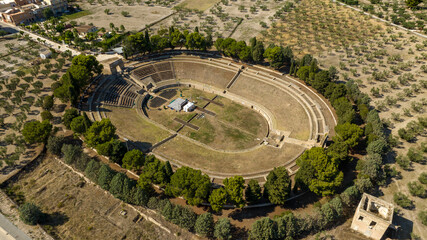 Aerial view of the Roman amphitheater of Lucera, in the province of Foggia, Puglia, Italy. It is a Roman amphitheater located on the outskirts of the town among olive groves.