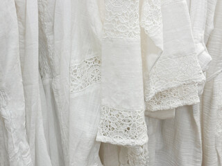 White dresses and sundresses with lace stitching made of cotton, viscose, linen for hot weather.