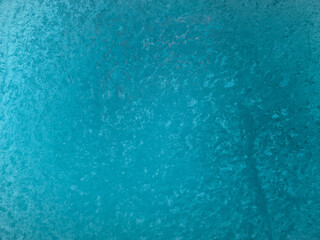 A blue background with a white line running through it. The blue background is the dominant color of the image, while the white line adds a contrasting element to the scene.