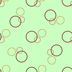 Seamless pattern with colored rings on green