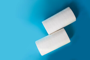 Two long rolls of tissues for food placed on a blue background. Ready to add text, ready to use, ready to add ideas