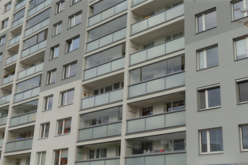 A Contemporary Apartment Building Featuring Stylish Balconies and Large Windows