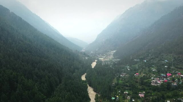 Aerial view of himalayan mountains at kasol himachal pradesh. Small villages and colorful local houses nested in the hills of parvati valley at kasol, himachal pradesh, India.