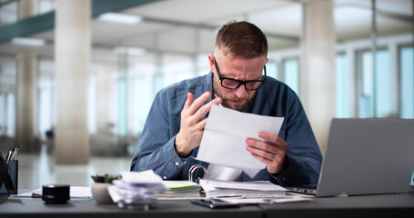 Shocked Businessman Tearing Bill Document