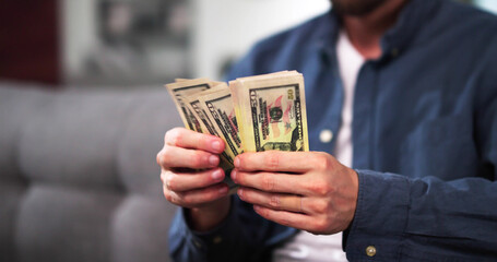 Man Counting Cash Dollar Bills