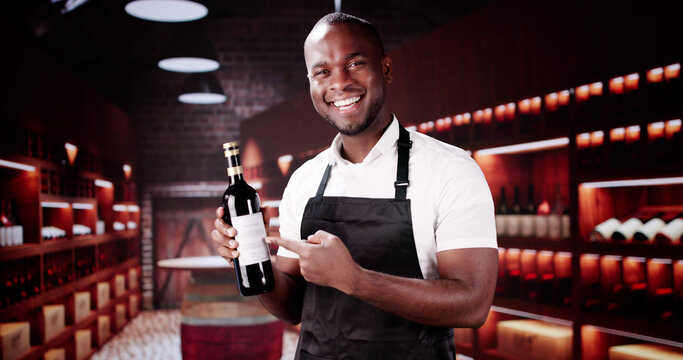 Wine Service Waiter Holding A Bottle