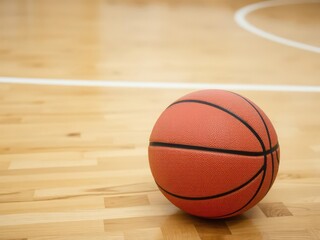 Obraz premium A close-up shot of a basketball lying on a wooden court floor, competitive, athletes
