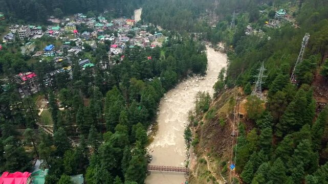 Aerial view of himalayan mountains at kasol himachal pradesh. Small villages and colorful local houses nested in the hills of parvati valley at kasol, himachal pradesh, India.