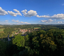 Aerial landscape with clouds and mountains. View of the city of Wlen, Poland from the air. View from a drone