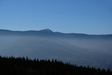 Panorama view of the top of Mount Sniezka, Poland. Mountain landscape in the morning fog.