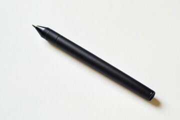 Black pen resting on a white surface