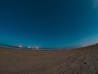 Wonderful seascape with golden beach at night. Dutch archipelago at the North Sea in summer time