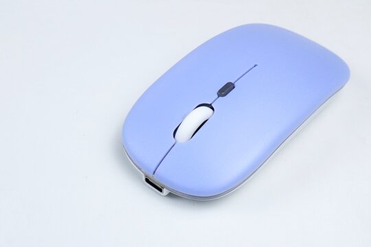 purple computer mouse on a white background