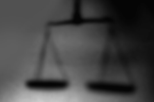 Crown of thorns and rosary beads on brown texture background with space for text