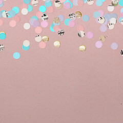 Recycled Paper Confetti on Dusty Pink Background