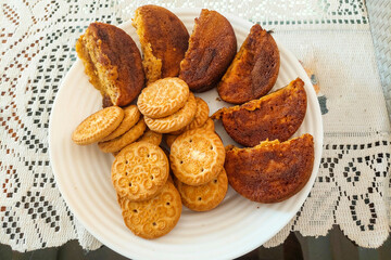 Biscuits and Wet Cakes on a White Plate