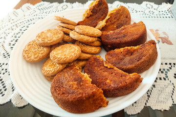 Biscuits and Wet Cakes on a White Plate