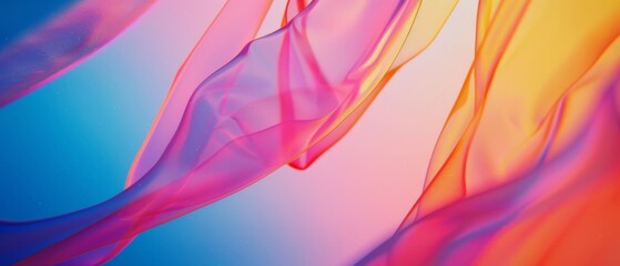 Fototapeta premium Delicate sheer fabrics in a swirl of warm pinks and yellows create an airy, dreamy visual, evoking feelings of lightness and creative inspiration.