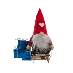 New Year's soft toy gnome on a sled with gifts 