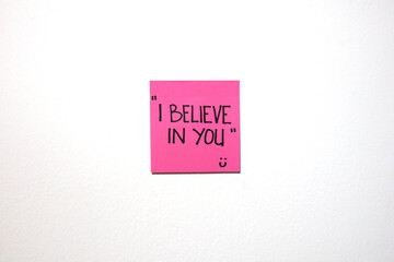 Motivational and love message on a sticky notes with isolated white background.