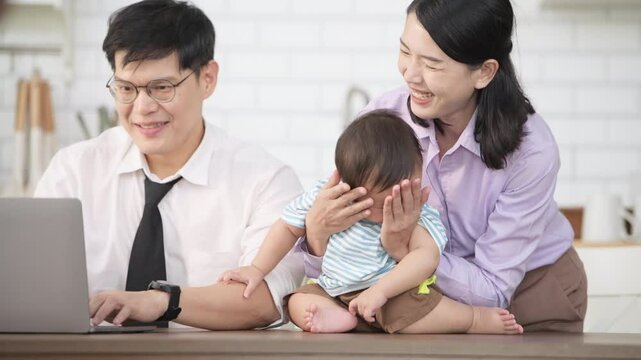 Parents and son play together after dad comes home from work