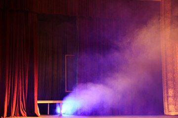 Professional spotlight and smoke on stage in theatre