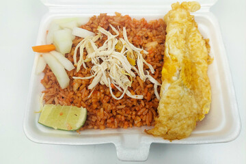 Indonesian food - red fried rice in a rice box on the dining table